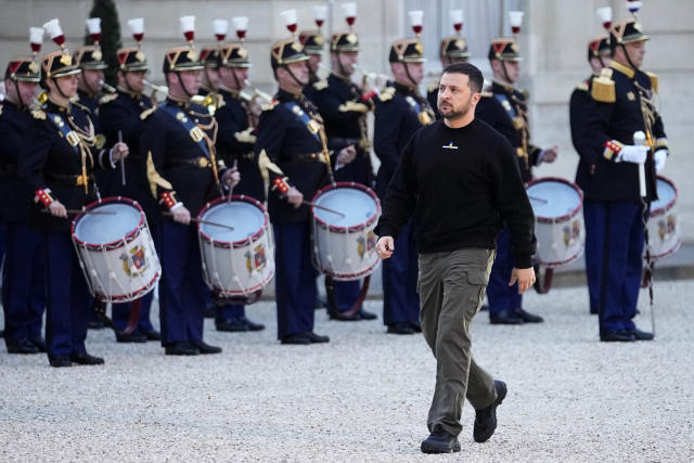 FILE - Ukrainian President Volodymyr Zelenskyy walks past Republican Guards as he arrives at the Elysee palace in Paris, Sunday, May 14, 2023. While the world awaits Ukraine's spring offensive, its leader Volodymyr Zelenskyy has already launched a diplomatic one. In a span of a week, he has dashed to Italy, the Vatican, Germany, France and Britain to shore up support for the defense of his country. On Friday, May 19, 2023, he was in Saudi Arabia to meet with Arab leaders, some of whom are allies with Moscow. (AP Photo/Michel Euler, File)