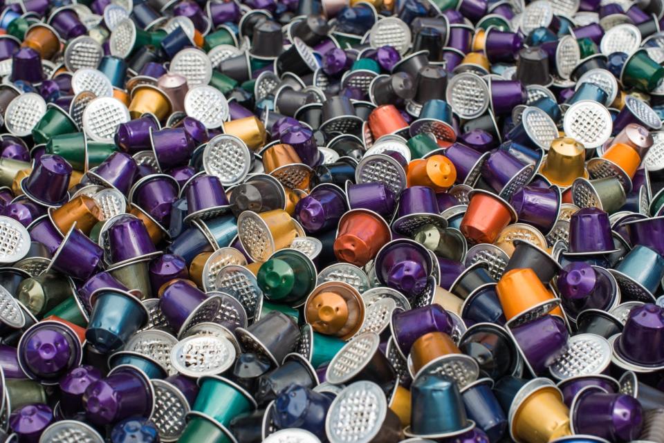 A large quantity of different colored used Nespresso pods. 