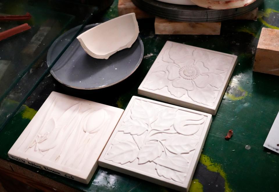 Tiles prior to glazing at Rookwood Pottery. The facility has a room with molds dating back to the early 1900s.