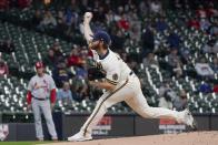 Milwaukee Brewers starting pitcher Brandon Woodruff throws during the first inning of a baseball game against the St. Louis Cardinals Wednesday, May 12, 2021, in Milwaukee. (AP Photo/Morry Gash)