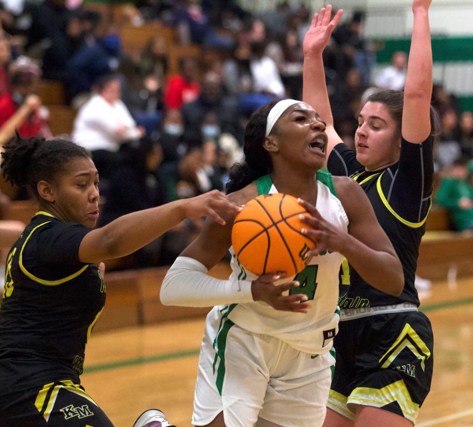 Ashbrook's Kennette Bess tries to split a pair of Kings Mountain defenders during Friday's Big South 3A girls matchup in Gastonia.