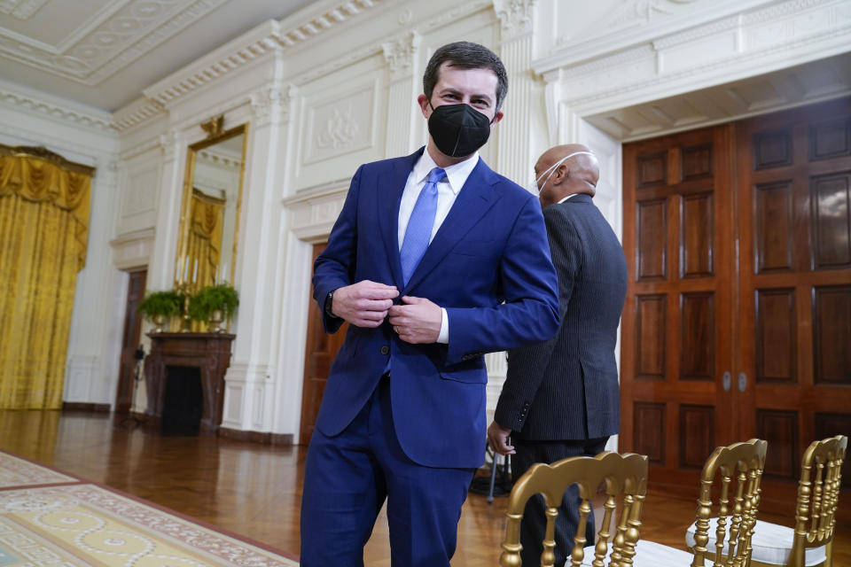 Transportation Secretary Pete Buttigieg arrives to attend an event on the global supply chain bottlenecks during in the East Room of the White House, Wednesday, Oct. 13, 2021, in Washington. (AP Photo/Evan Vucci)