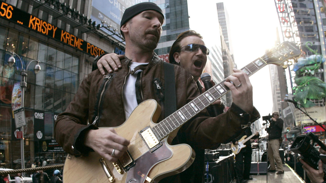  The Edge and Bono of U2 spend the day on the streets of New York City shooting a video for their new album "How to Dismantle an Atomic Bomb" which drops tomorrow, Tuesday, November 23rd. U2 finished off the day in Brooklyn at the Empire-Fulton Ferry State Park where they played songs off of their new album for their fans. MTV captured the show for future broadcast. 