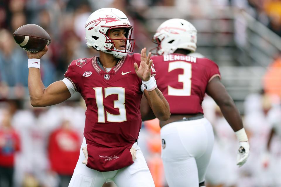 Jordan Travis of the Florida State Seminoles looks to pass during the first half of the game between the Florida State Seminoles and the Boston College Eagles