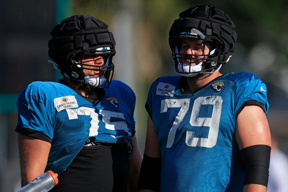 Jacksonville Jaguars center Luke Fortner (79) laughs while talking with guard Cooper Hodges (75) during training camp Monday, Aug. 7, 2023 at Miller Electric Center at EverBank Stadium in Jacksonville, Fla. This was the 11th day of training camp. 