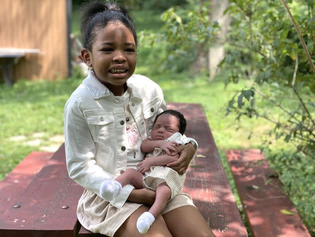 Coleman’s daughters pose for a family portrait at a park in Gaithersburg, Maryland, in 2020. Coleman felt that much of his treatment throughout his second pregnancy was motivated more because of racism than because of transphobia.