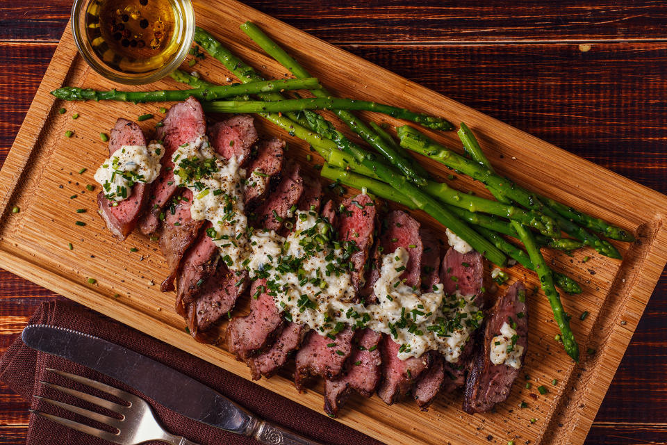 Serve asparagus with meat such as steak or pork. Top the meat with a peppercorn or blue cheese sauce. (Getty Image)