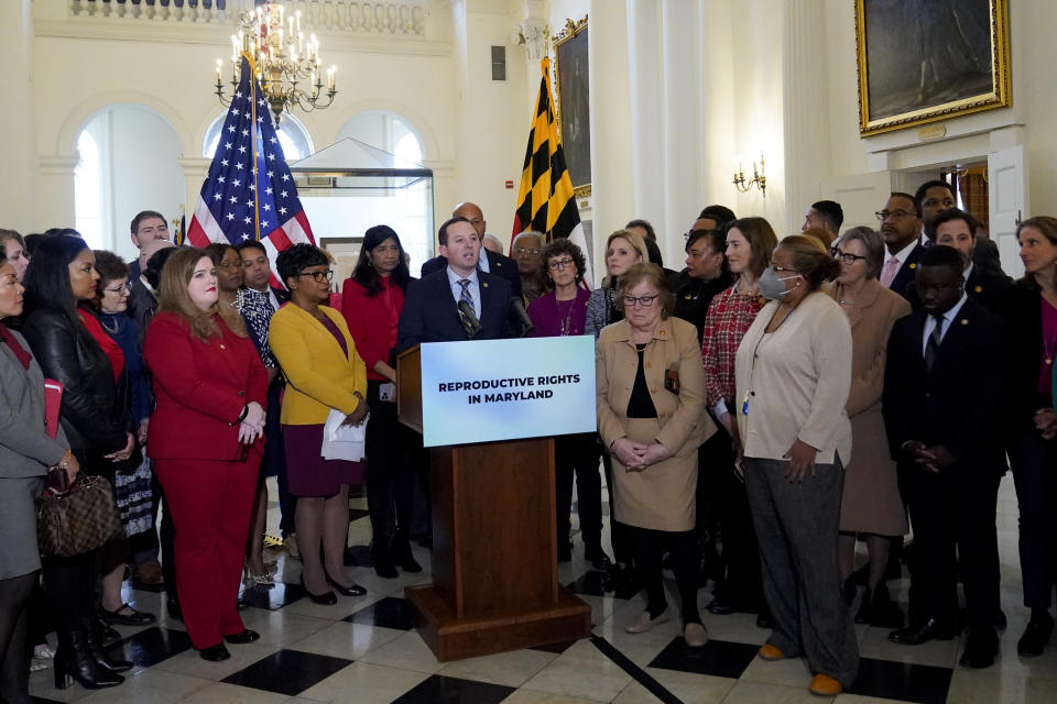 Maryland Senate President Bill Ferguson, D-Baltimore, center, stands at the podium with lawmakers during a news conference at the statehouse, Thursday, Feb. 9, 2023, in Annapolis, Md. State lawmakers announced support for measures protecting abortion rights, including a state constitutional amendment that would enshrine it. (AP Photo/Julio Cortez)