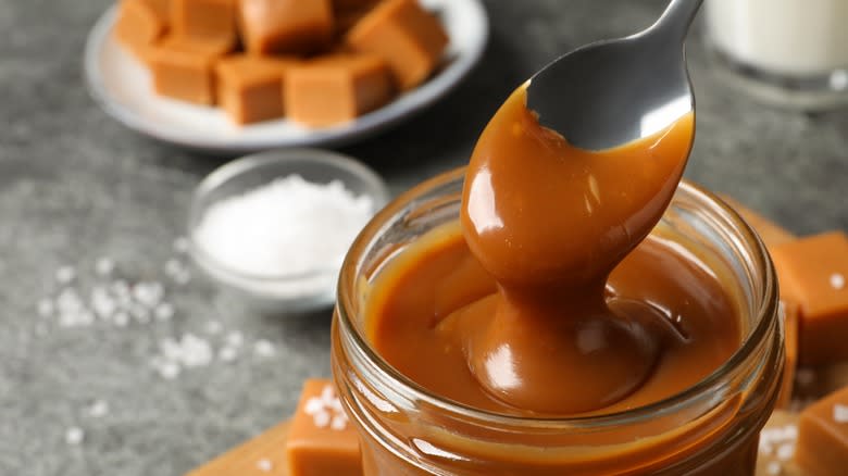 Jar of salted butterscotch with candies 