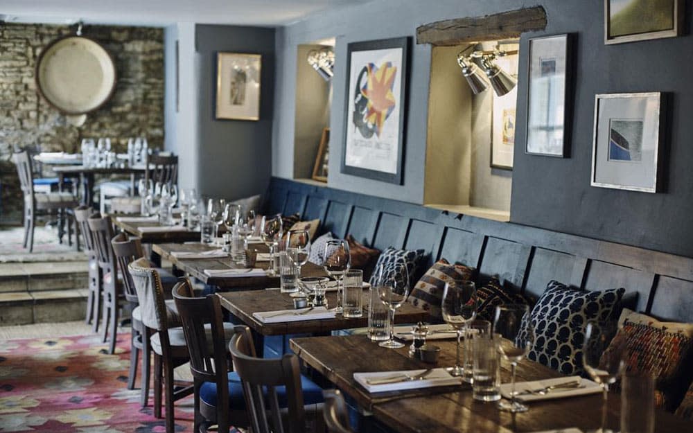 The Bull, a 16th-century coaching inn, oozes atmosphere with its inglenook fireplace, stone walls and beams.