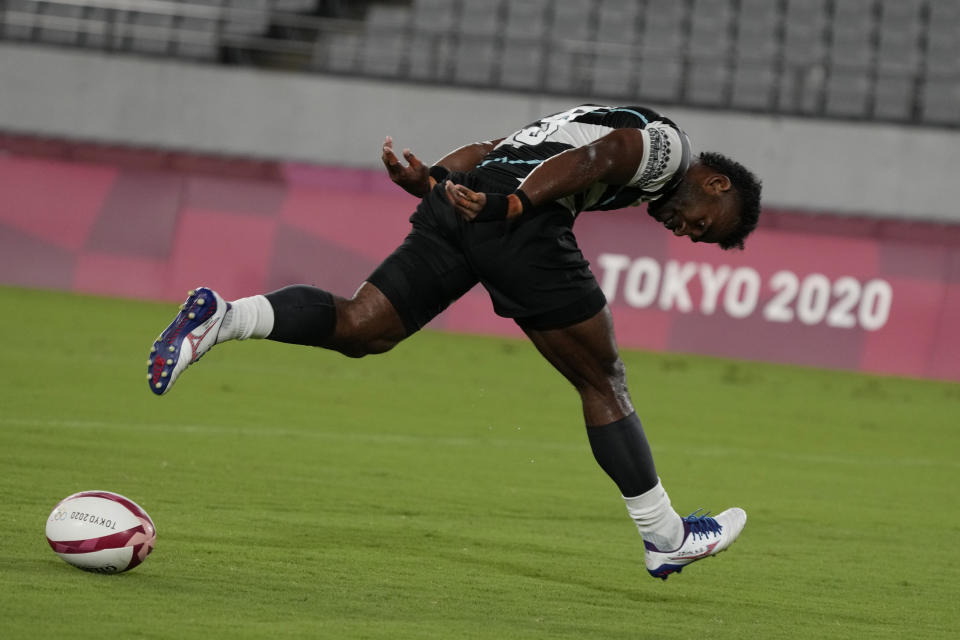 Fiji's Jerry Tuwai scores a try in Fiji's men's rugby sevens quarterfinal match against Australia, at the 2020 Summer Olympics, Tuesday, July 27, 2021 in Tokyo, Japan. (AP Photo/Shuji Kajiyama)