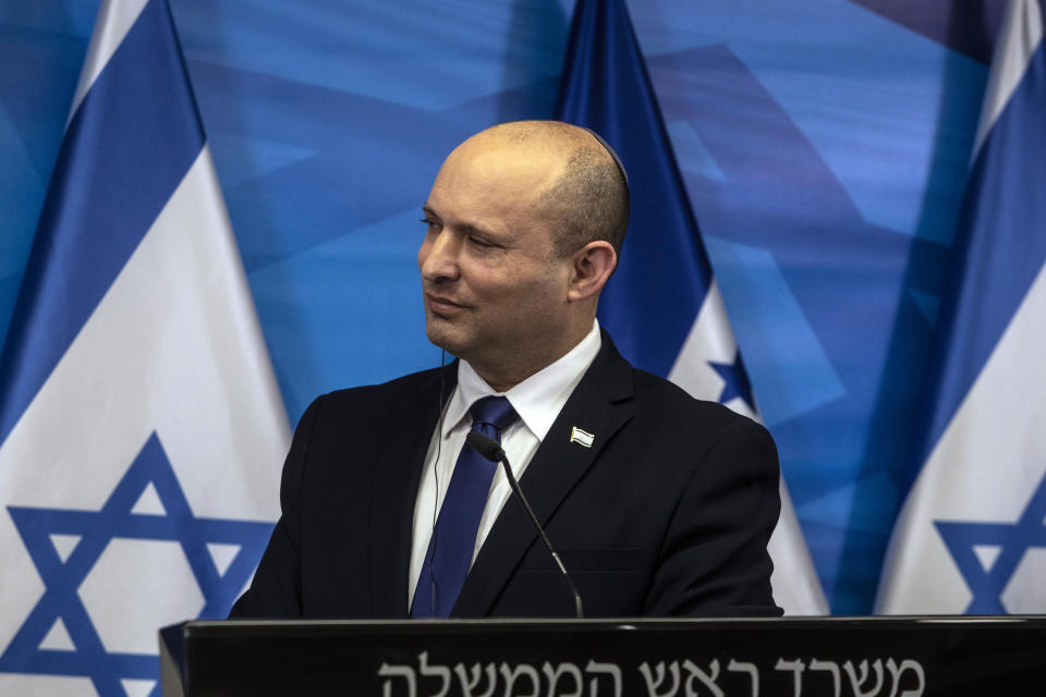 Israeli Prime Minister Naftali Bennett, gives statements with Honduran President Juan Orlando Hernandez, after their meeting at the prime minister's office, in Jerusalem, Thursday, June 24, 2021. (Heidi Levine/Pool via AP).