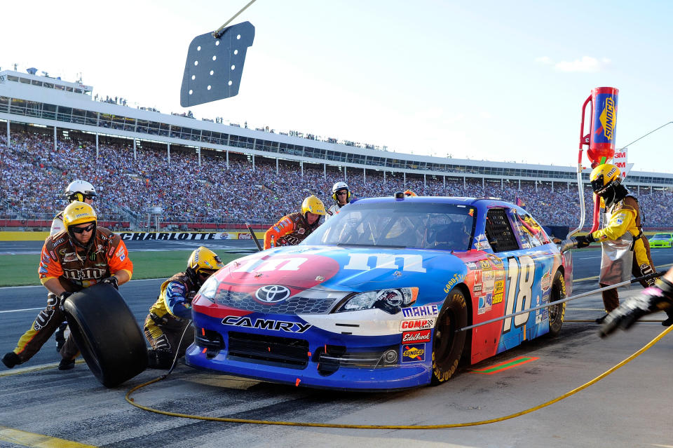 Kyle Busch, driver of the #18 M&M's Red, White & Blue Toyota, pits during the NASCAR Sprint Cup Series Coca-Cola 600 at Charlotte Motor Speedway on May 27, 2012 in Concord, North Carolina. (Photo by John Harrelson/Getty Images for NASCAR)