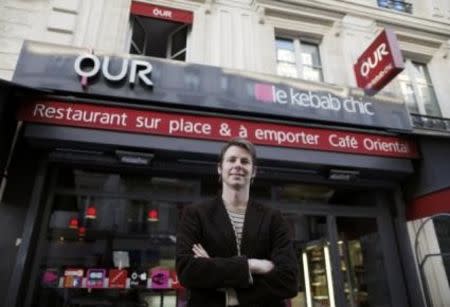 OUR kebab founder and CEO Damien Schmitz poses for Reuters in his restaurant near the Saint-Lazare train station in Paris October 27, 2014. REUTERS/Christian Hartmann