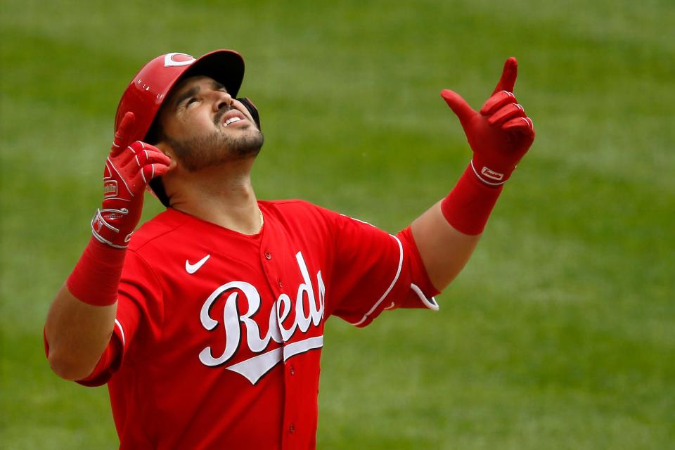 Reds shortstop Eugenio Suarez celebrates a solo home run in the third inning.