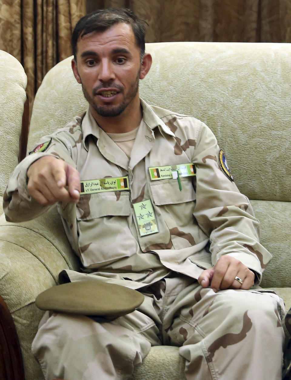 In this Aug. 4, 2016 photo, Gen. Abdul Raziq, Kandahar police chief, speaks during an interview with The Associated Press in Kandahar, Afghanistan. Three top Kandahar officials, including Raziq, were killed by their own guards Thursday, Oct. 18, 2018, although a Taliban spokesman who claimed responsibility told The Associated Press in a telephone interview that U.S Gen. Scott Miller, commander of US and NATO troops in Afghanistan was the target. Miller was unhurt but two U.S. troops were injured and evacuated. (AP Photo/Massoud Hossaini)