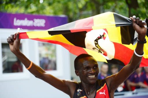 Uganda's Stephen Kiprotich waves his national flag as he celebrates winning the Olympic marathon in London on August 12. Kiprotich stunned a strong Kenyan team to win the men's Olympic marathon on Sunday, handing his east African nation only their second ever gold medal