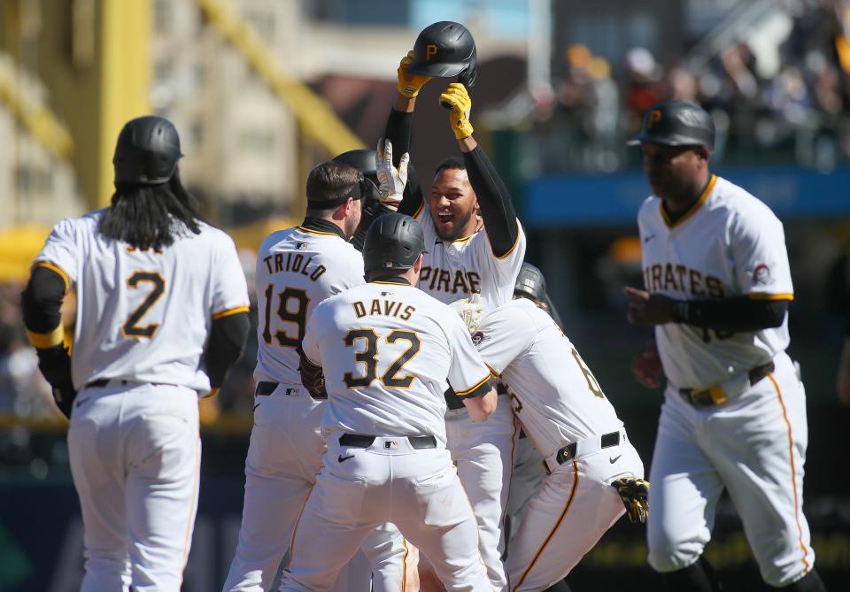 Pittsburgh Pirates outfielder Edward Olivares (38) celebrates with his team after hitting a walk-off and defeating the Baltimore Orioles 3-2 Sunday afternoon at PNC Park in Pittsburgh.