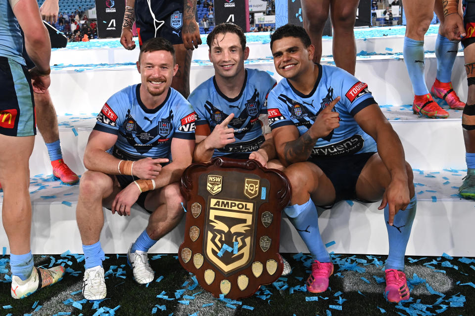 Damien Cook, Cameron Murray and Latrell Mitchell, pictured here after NSW's State of Origin triumph in 2021.