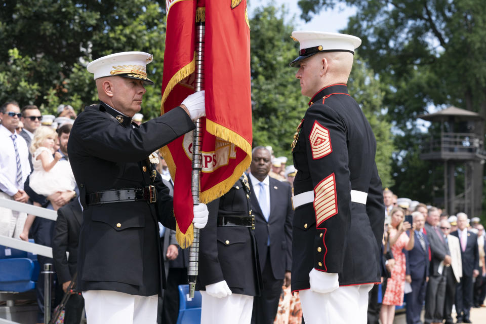 U.S. Marine Corps Gen. David Berger, left, whose term as Commandant of the U.S. Marine Corps expires Monday, holds the battle colors during a relinquishment of office ceremony, Monday, July 10, 2023, at the Marine Barracks in Washington. Assistant Commandant Gen. Eric Smith, right, has been nominated to be the next leader, but will serve in an acting capacity because he hasn't been confirmed by the Senate. (AP Photo/Manuel Balce Ceneta)