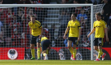 Britain Soccer Football - AFC Bournemouth v Middlesbrough - Premier League - Vitality Stadium - 22/4/17 Middlesbrough's Ben Gibson and team mates looks dejected after Bournemouth's Charlie Daniels scored their fourth goal Action Images via Reuters / Matthew Childs