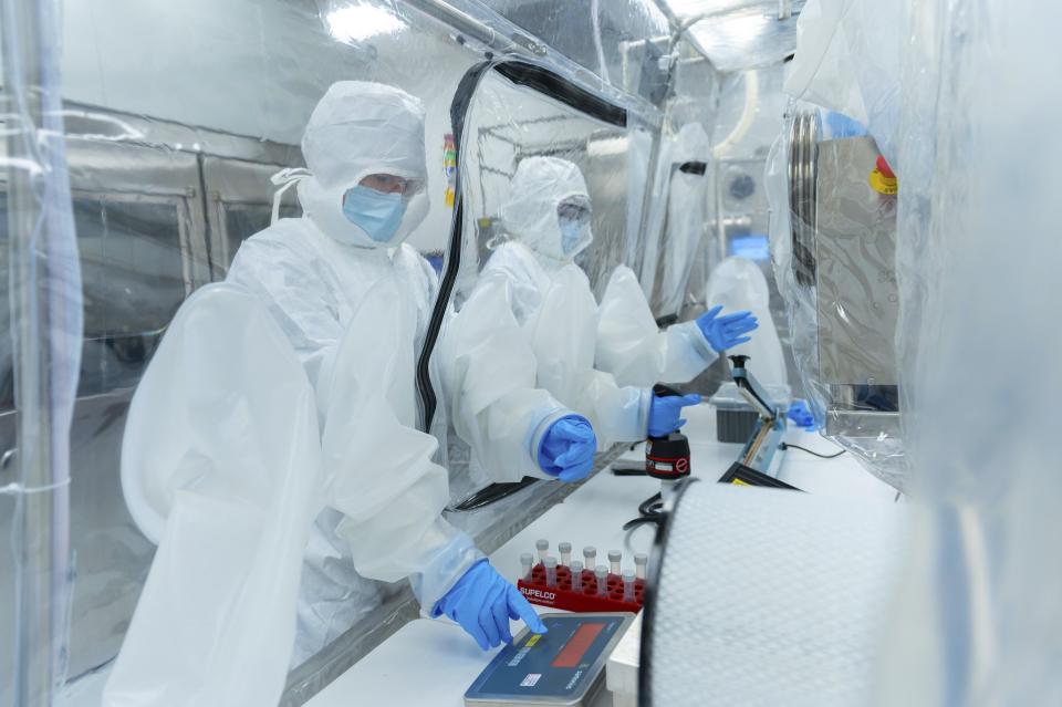 In this photo provided by Seres Therapeutics, technicians use an anaerobic chamber to prepare oral microbiome drugs for clinical studies in the company's Cambridge, Mass., facility in May 2022. On Wednesday, April 26, 2023, U.S. health officials approved the first pill made from healthy bacteria found in human waste to fight dangerous gut infections — an easier way of performing so-called fecal transplants. (Genevieve de Manio/Seres Therapeutics via AP)