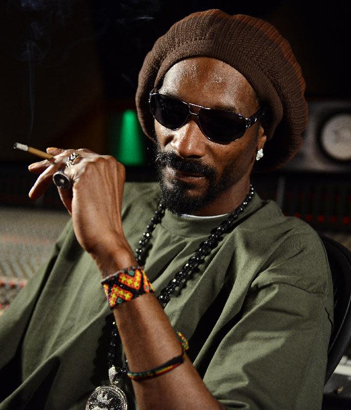 In this Tuesday, March 5, 2013 photo, Snoop Lion poses for a portrait at the Westlake Recording Studios in Los Angeles. How committed is Snoop Dogg to his new moniker Snoop Lion? While promoting an accompanying documentary that tracks his trip to Jamaica and exploration of the Rastafarian culture and religion, Snoop says Lion is less a lifestyle transformation than a personal evolution. (Photo by Jordan Strauss/Invision/AP)