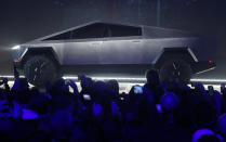 The Tesla Cybertruck is unveiled at Tesla's design studio Thursday, Nov. 21, 2019, in Hawthorne, Calif. CEO Elon Musk is taking on the workhorse heavy pickup truck market with his latest electric vehicle. (AP Photo/Ringo H.W. Chiu)