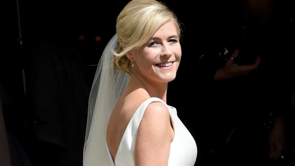 Declan Donnelly's bride Ali Astall looking over her shoulder in a wedding dress