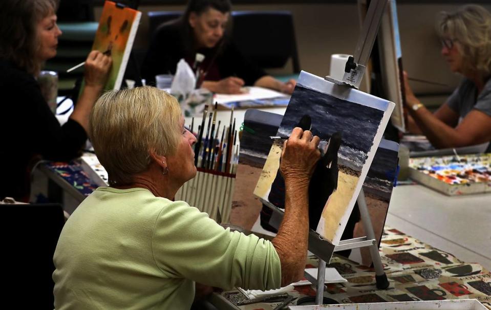 Peggy Wallace of Pasco works on her painting during a recent weekday drop-in Creative Palette Art session at the Kennewick Coummunity Center in downtown Kennewick. She’s joined in the weekly activity by Karen Walsh of Burbank, Gwen Bowden of Kennewick and Hazel Shepard of Burbank, from left.
