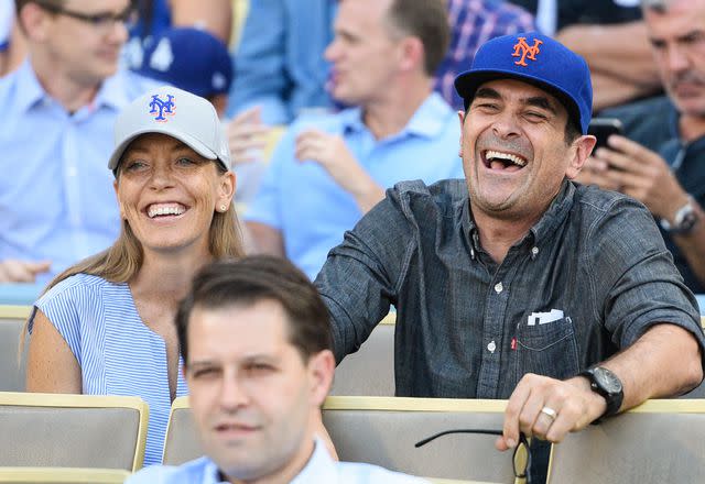 <p>Noel Vasquez/Getty </p> Ty Burrell and Holly Burrell attend game five of the National League Division Series between the New York Mets and the Los Angeles Dodgers on October 15, 2015 in Los Angeles, California.