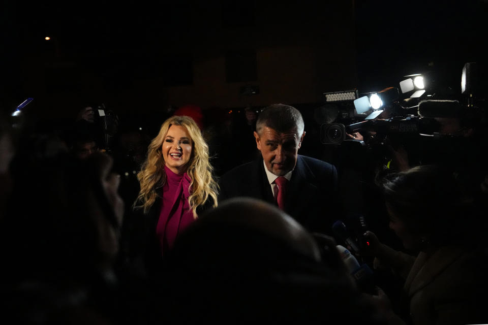 Presidential candidate Andrej Babis accompanied with his wife Monika arrives to address media after the preliminary results for the first round of presidential election in Prague, Czech Republic, Saturday, Jan. 14, 2023. (AP Photo/Petr David Josek)