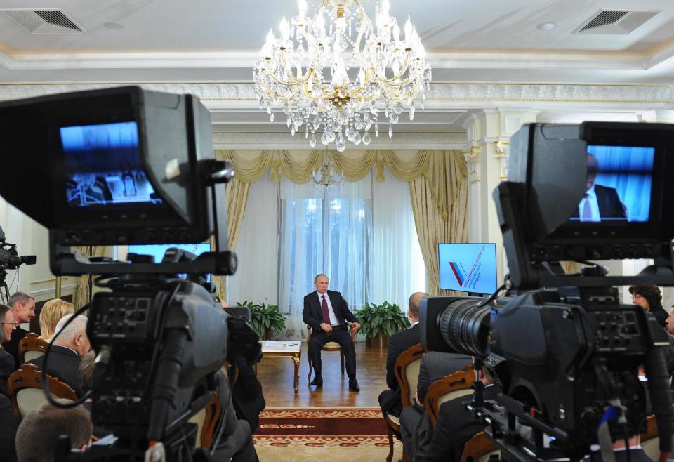 Russian President Vladimir Putin speaks during a meeting with the People's Front activists in the Novo-Ogaryovo residence outside Moscow on Thursday, April 10, 2014. Vladimir Putin has reached out to European leaders to discuss Ukraine's growing gas debt to Moscow, according to the Russian president's press secretary. (AP Photo/RIA-Novosti, Mikhail Klimentyev, Presidential Press Service)