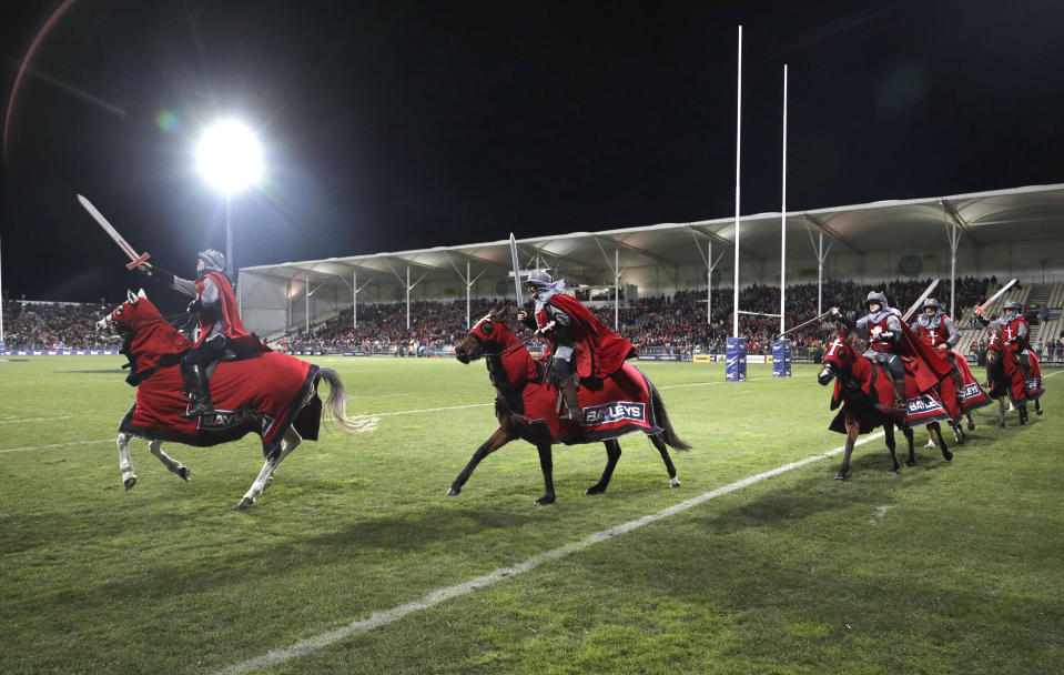 FILE - In this July 28, 2018, file photo, the Crusader horseman ride around the arena prior to the start of their Super Rugby semifinal match between the Crusaders and the Hurricanes in Christchurch, New Zealand. The Crusaders announced Wednesday, April 3, 2019, that they will be considering a change to their name and branding following the Christchurch terrorist attacks on March 15 - insisting the status quo is 'no longer tenable."(AP Photo/Mark Baker, File)
