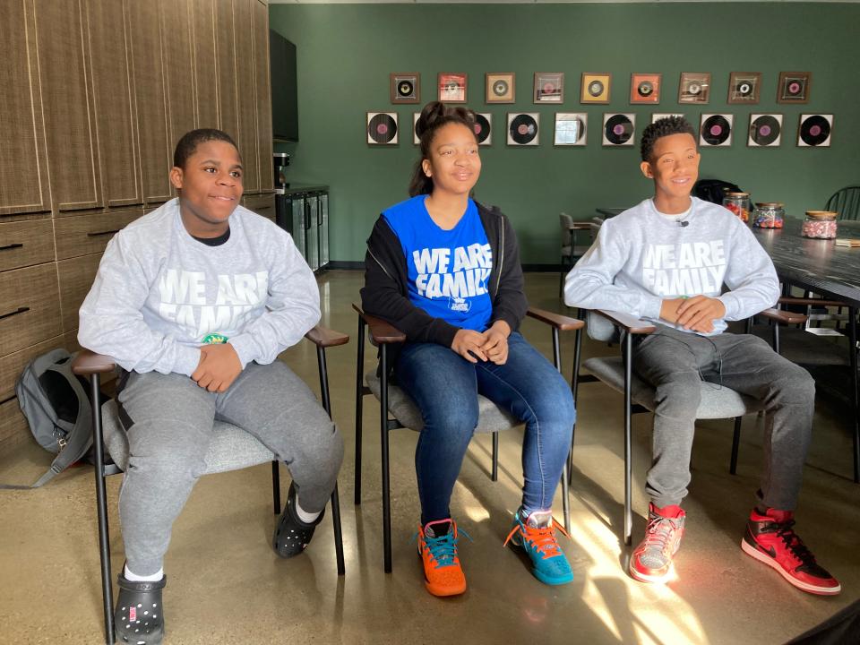 I Promise School basketball players Ernest Pitts (left), Amaris Scott and Treyshaun Tolbert pose for a photo.