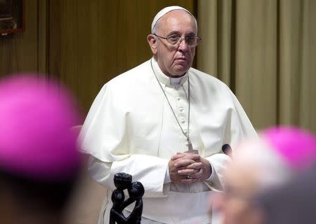 Pope Francis looks on as he leads the synod of bishops in Paul VI's hall at the Vatican October 6, 2014. REUTERS/Claudio Peri/Pool