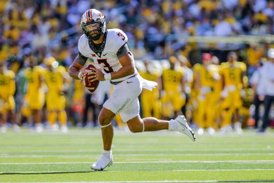 FILE - Then-Oklahoma State quarterback Spencer Sanders (3) scrambles out of the pocket during the first half of an NCAA college football game against Baylor in Waco, Texas, Saturday, Oct. 1, 2022. Sanders now plays for Ole Miss. Ole Miss opens their season at home against Mercer on Sept. 2. (AP Photo/Gareth Patterson, File)