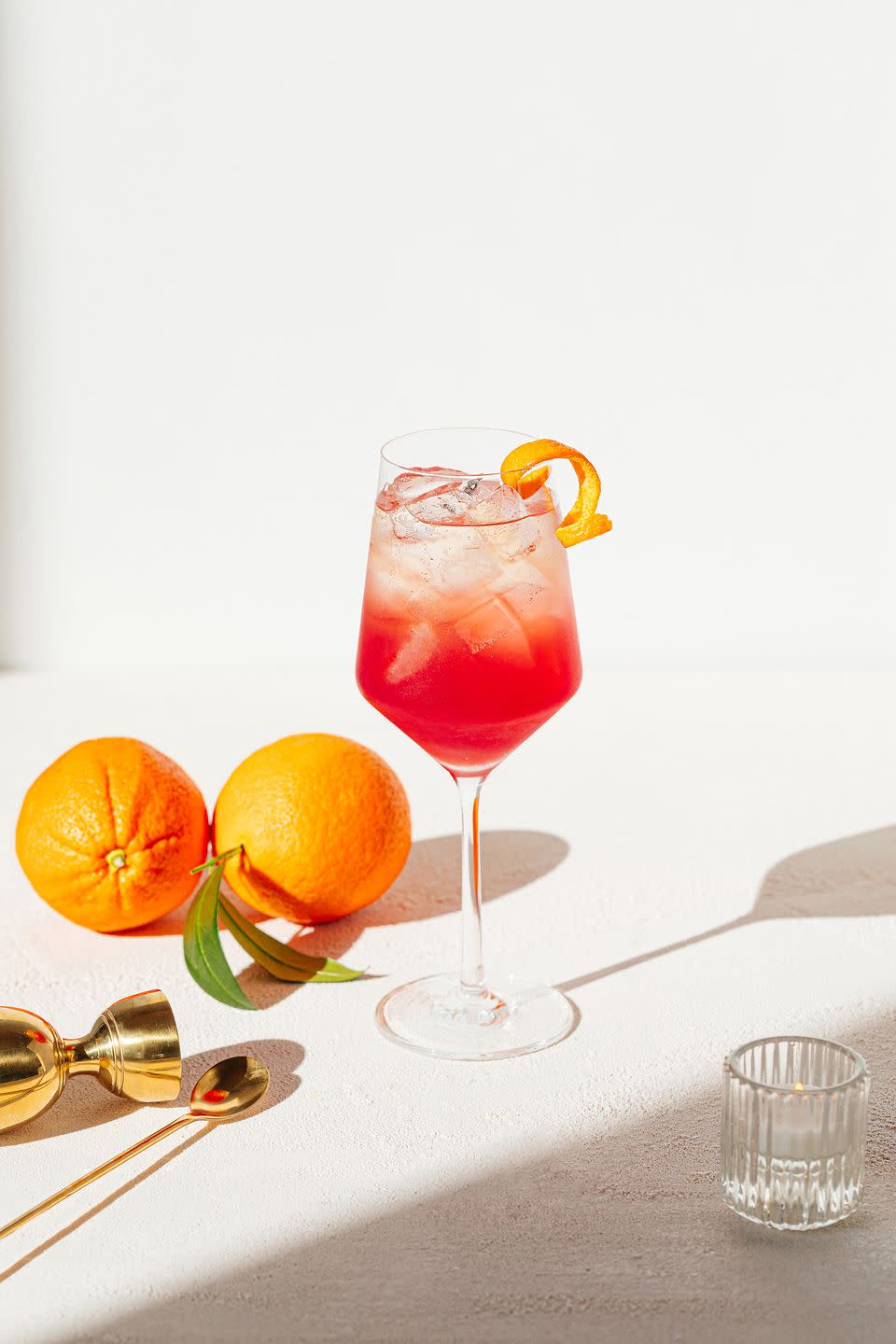 <p><strong>Ingredients</strong></p><p>2 oz Lillet Blanc<br>.5 oz fresh lemon juice<br>1-2 tablespoon cranberry sauce<br>3 oz brut champagne</p><p><strong>Instructions</strong></p><p>Combine all ingredients except the champagne in a cocktail shaker. Shake and fine strain into glasses and top with bubbles. Garnish with candied orange peel.</p>