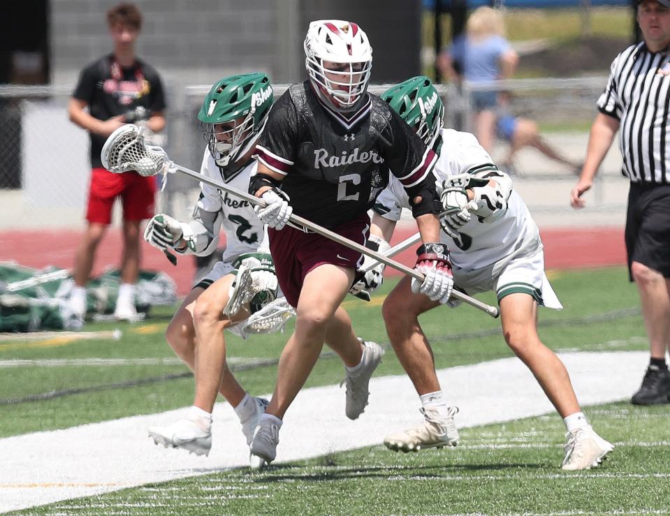 Scarsdale's Julian Glantz (2) breaks away from Shenendehowa defenders during the boys lacrosse Class A regional final at Shaker High School in Albany on Saturday. Scarsdale won the game 14-6.