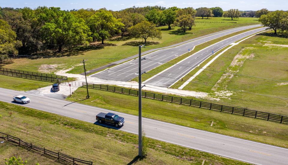 Traffic travels along Southwest 66th Street near the Southwest 49th Avenue intersection in March. The Southwest 49th Avenue project had stalled due to the power poles needing to be moved. It is now open.