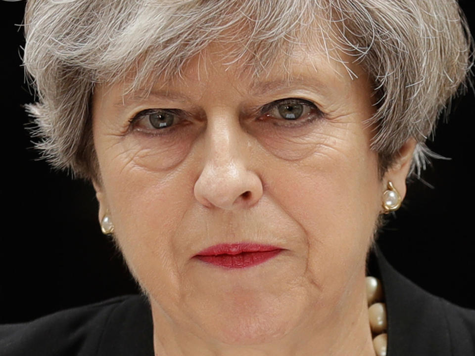 Theresa May addresses the media outside 10 Downing Street: AP