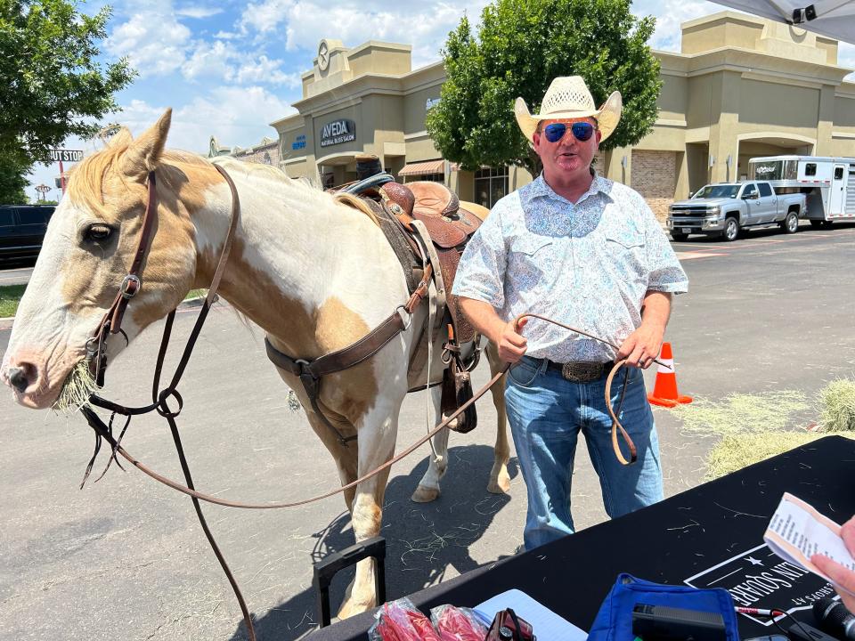 Even a horse showed up at the 60 Years of Wolflin Square on Friday. Michelle Labrier's husband, Gary, and son, Hayden, took part in the fun. Labrier owns the Merle Norman Studio started by her grandmother.