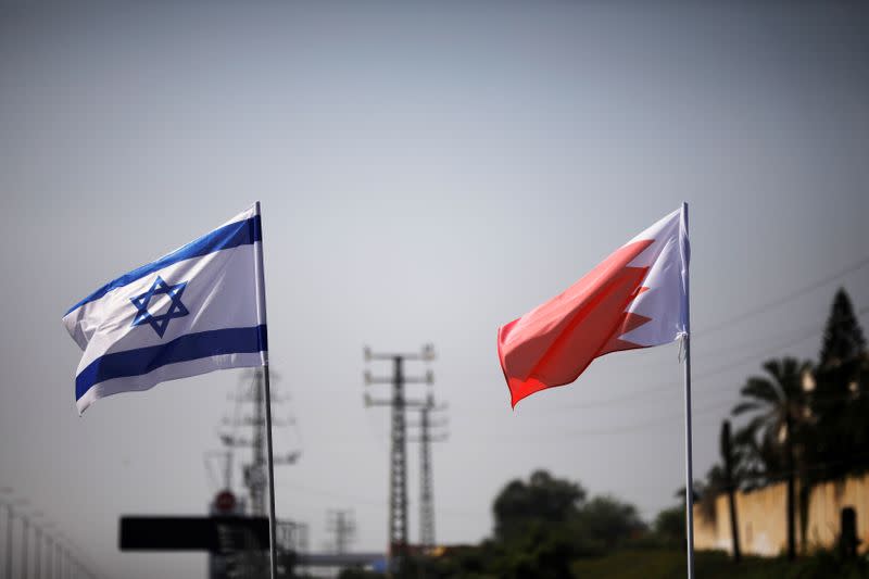 FILE PHOTO: The flags of Israel and Bahrain flutter along a road in Netanya