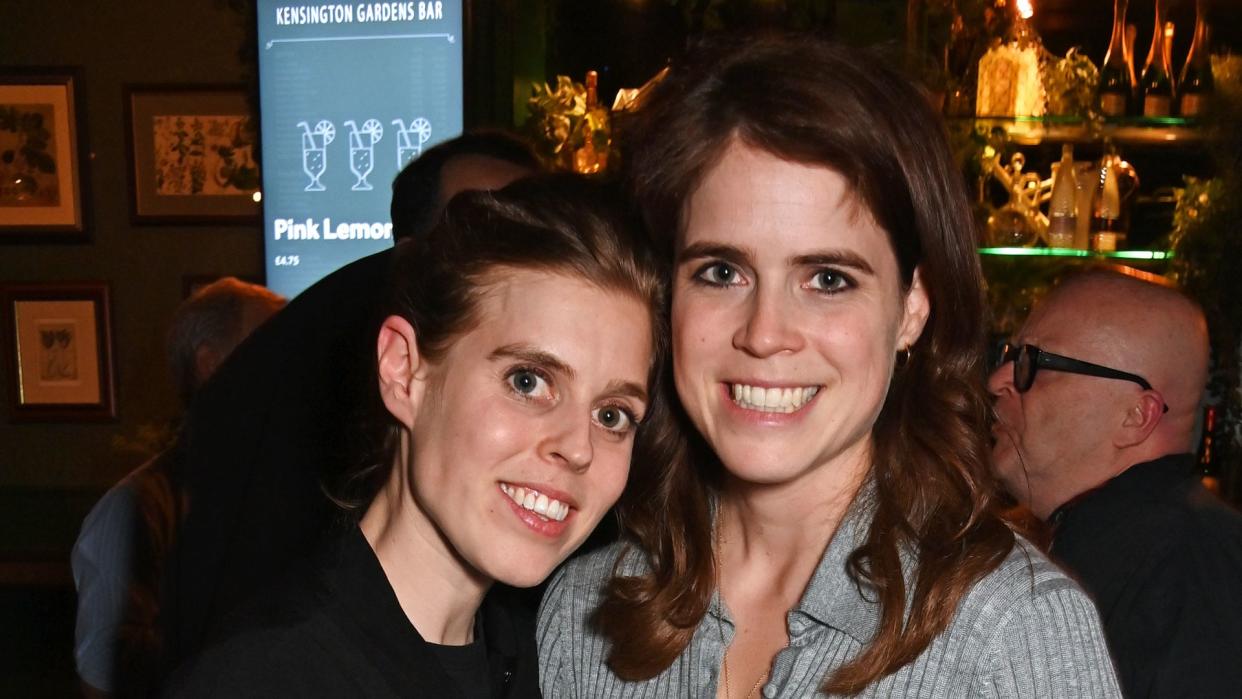 Princess Beatrice and Princess Eugenie embracing