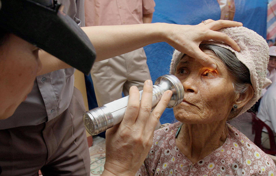 An elderly woman receives an eye examination for trachoma in Hiep Hoa village, in&nbsp;Thai Binh, Vietnam,&nbsp;July 6, 2005. (Photo: STR via Getty Images)