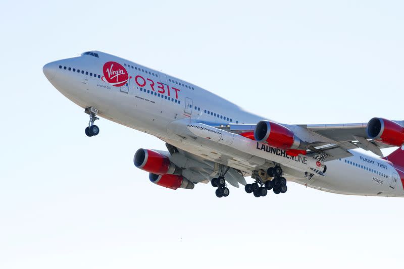 FILE PHOTO: Richard Branson's Virgin Orbit, with a rocket underneath the wing of a modified Boeing 747 jetliner, takes off to for a key drop test of its high-altitude launch system for satellites from Mojave, California