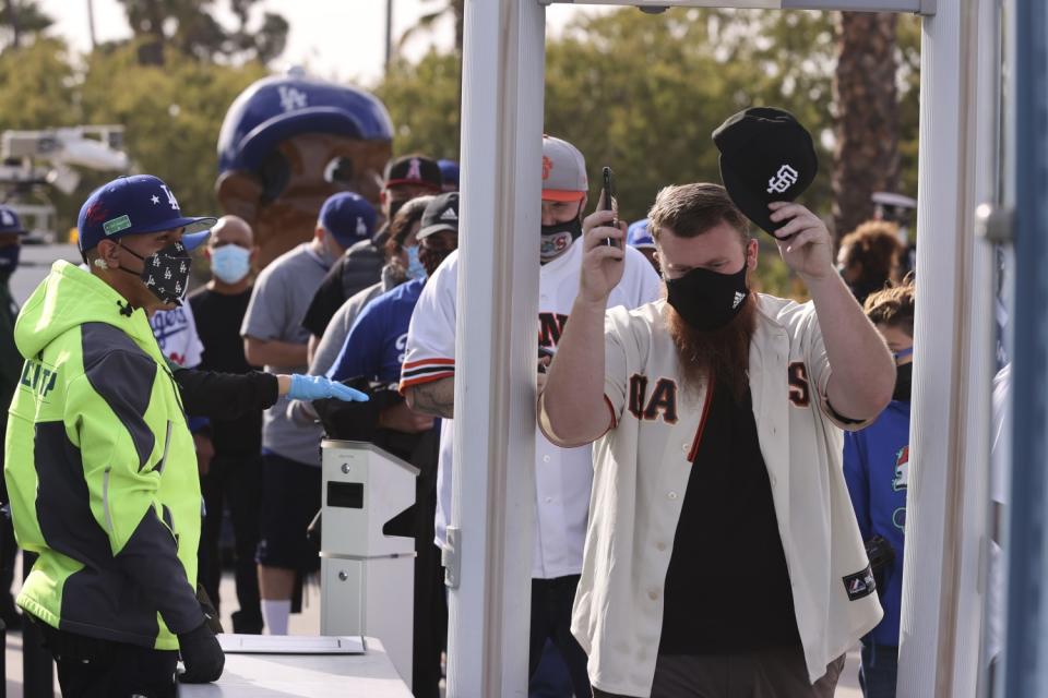 A San Francisco Giants fan enters security before game 3.