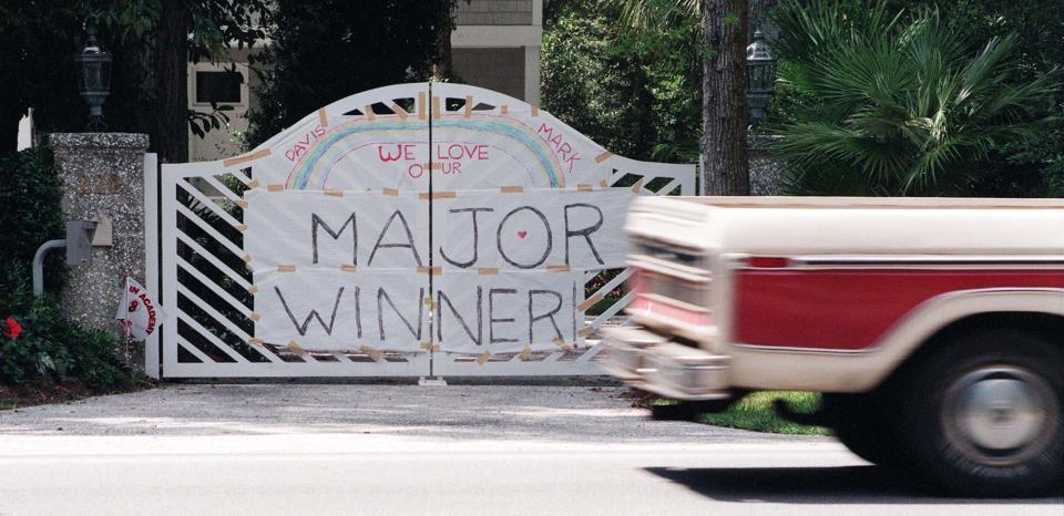 Fans made a homemade congratulatory sign and put it on the gate of Davis Love III's home in St. Simons Island, Ga., after he won the 1997 PGA Championship.