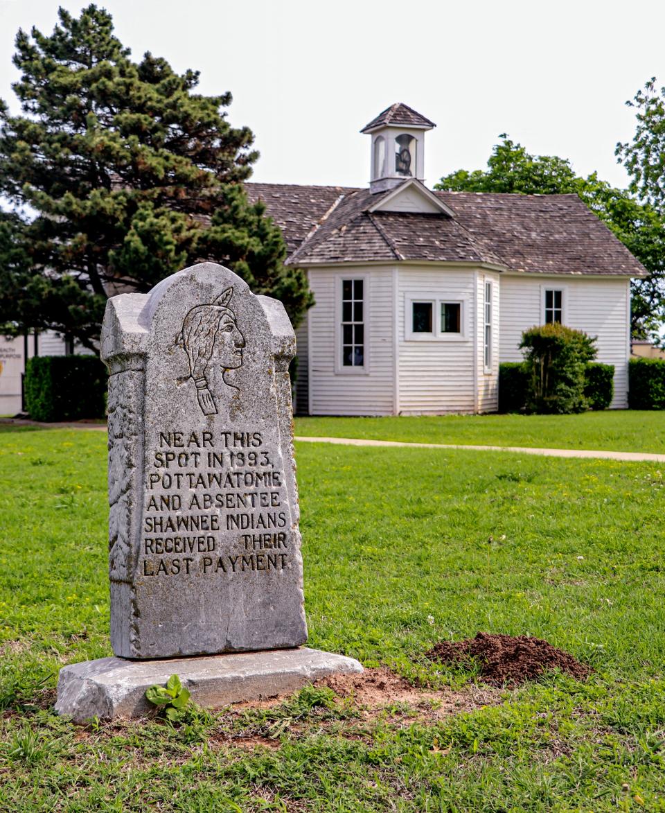 A stone erected in 1932 by the Pottawatomie County Historical Society marks the place where the Absentee Shawnee and Citizen Potawatomi Nation tribes received their last payments from the federal government in 1893, near the Shawnee Friends Mission.