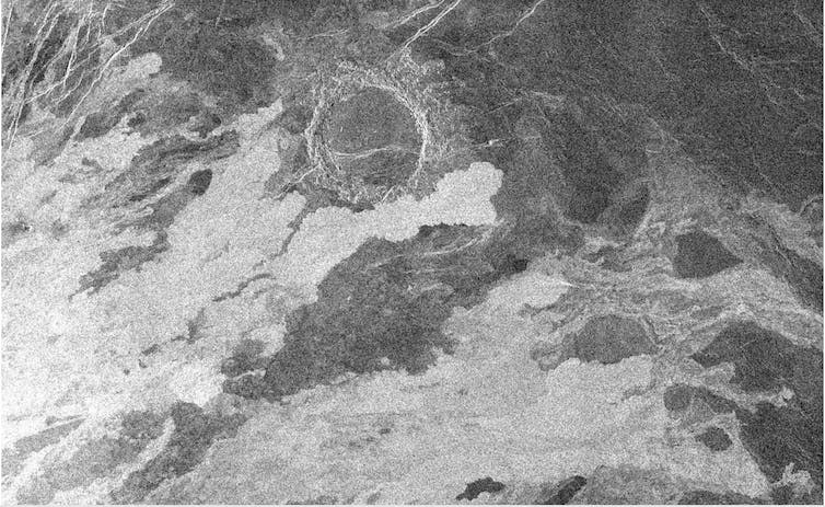 <span class="caption">140 km wide Magellan radar image of Venus showing lava flows (bright because they are rough) that have begun to encroach on an older impact crater.</span> <span class="attribution"><span class="source">NASA/JPL</span></span>